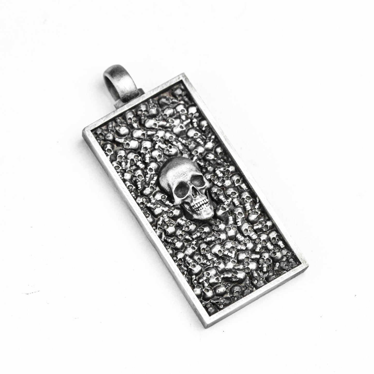 Intensive Skull Pendant, Tag Brass. Skull pendant in sterling silver. Knight Ornament, Thousand Faced Skull Pendant, Simple Silver